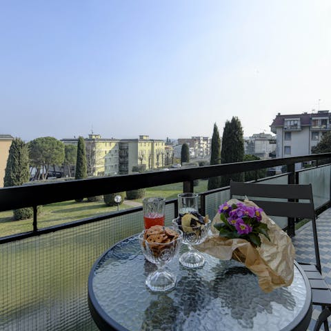 Watch the sunset from the private balcony
