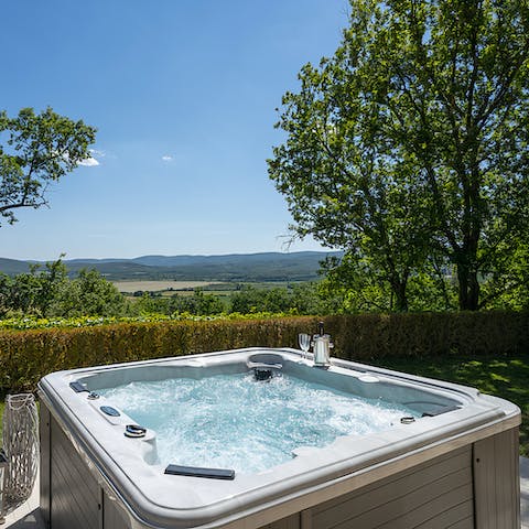 Soak in verdant views while unwinding in the hot tub