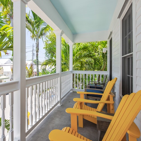 Watch the hustle and bustle of Duval Street from your balcony