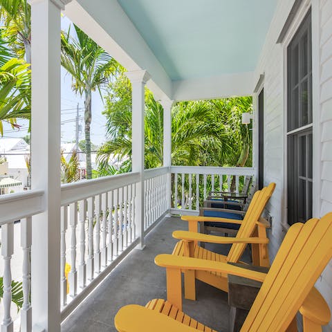 Watch the hustle and bustle of Duval Street from your balcony