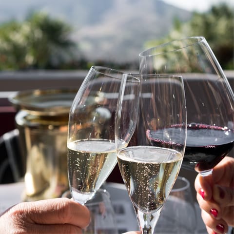 Enjoy drinks and dinner alfresco by the pool under the hot Ithaca sun
