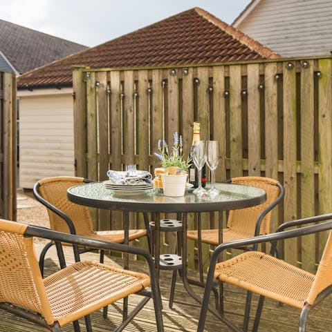 Enjoy dinner in the pretty decked garden space