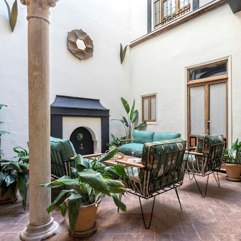 Relax in the traditional open-air courtyard on the ground floor