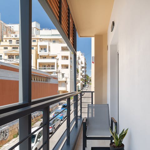 Watch the world go by from a chair on your cosy little balcony