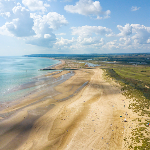 Stroll along Camber Sands, a ten-minute drive away