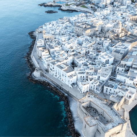 Explore the striking, whitewashed town of Monopoli, just a short drive away