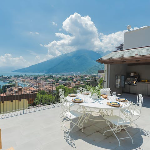 Dine alfresco with far-reaching lake and mountain views