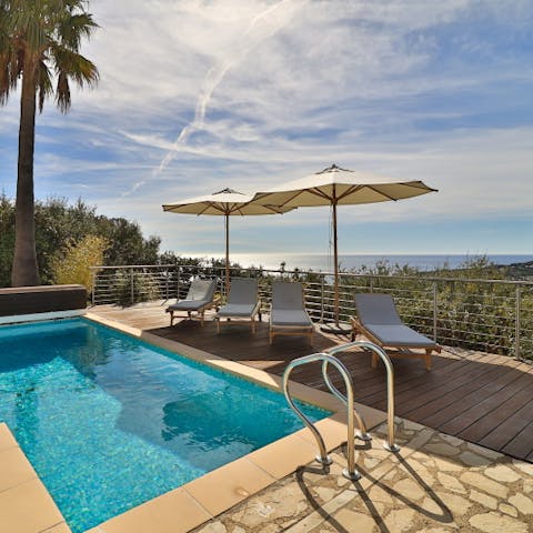 Chill out by the pool, complete with a stunning view of the Mediterranean
