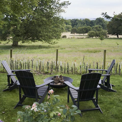 Gather around the firepit as the evening draws to a close
