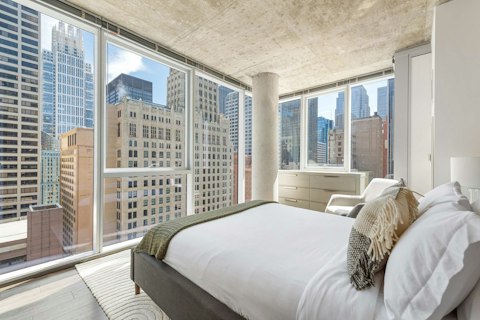 Wake to sweeping Chicago skyline views from bed