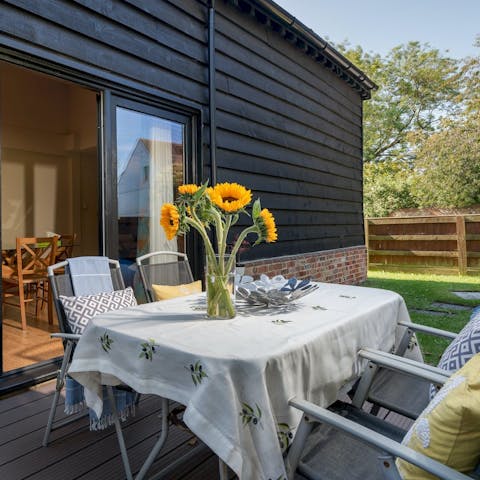 Set the table ready for an alfresco lunch on a warm afternoon