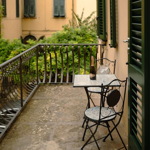 Enjoy an aperitivo on the private balcony