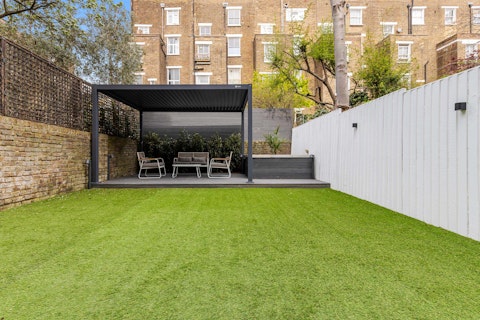 Unwind under the louvred pergola with alfresco drinks in the garden