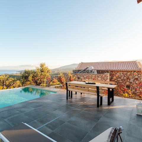 Enjoy a glass of wine and some Greek snacks on the patio