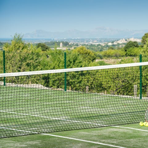 Have a game of tennis on the shared courts, but try not to get distracted by the sea vistas