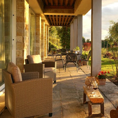 Toast the sunset with a glass of wine on the terrace