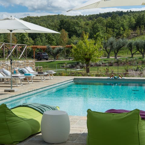 Unwind by the heated swimming pool after a workout in the gym