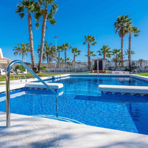 Cool off from the Malaga sun in the communal swimming pool