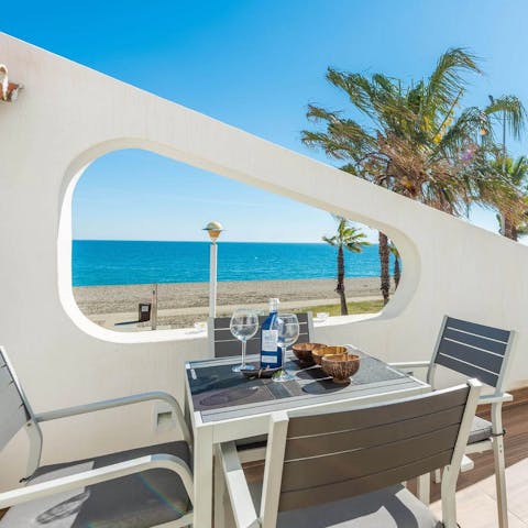 Enjoy a glass of wine on the balcony while admiring the coastal views