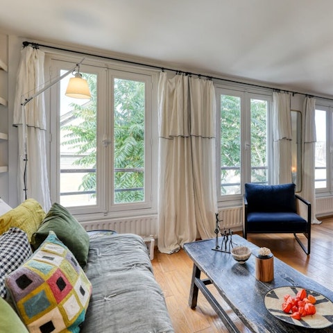 Relax in the light-filled living room complete with bohemian touches