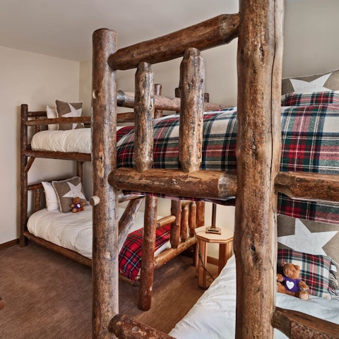 Feel like you're in a rustic mountain cabin among log bunk beds
