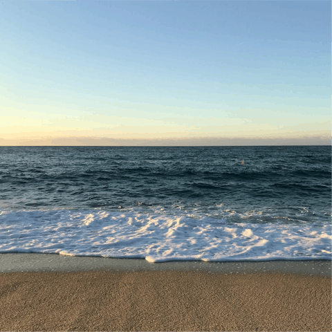 Watch the waves at Bonporteau Beach, just twelve-minutes walk away