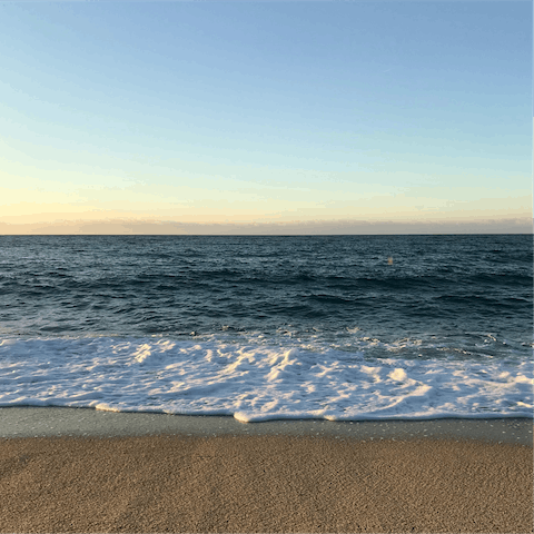 Watch the waves at Bonporteau Beach, just twelve-minutes walk away