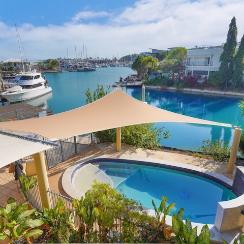 Admire marina views from the corner balcony or from the private pool