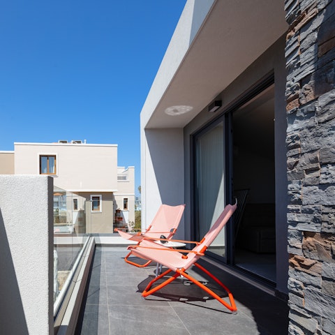 End the day with your tipple of choice on the balcony