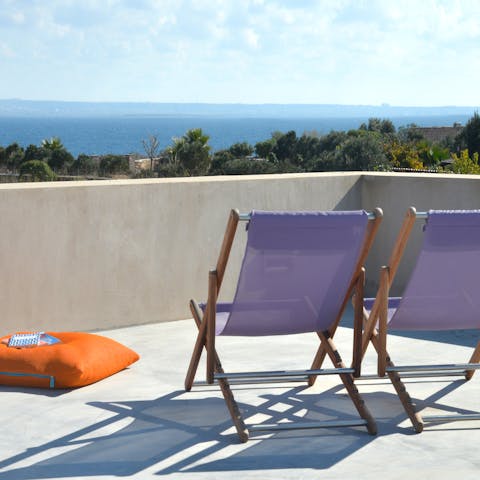 Admire the Mediterranean Sea views from the roof terrace