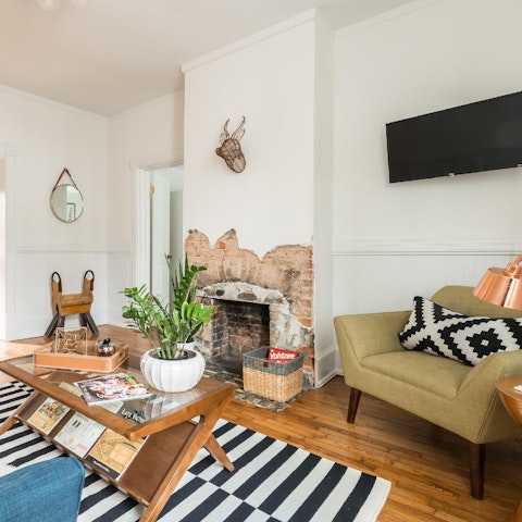 Relax in the characterful living room with a cosy fireplace and many unique period features