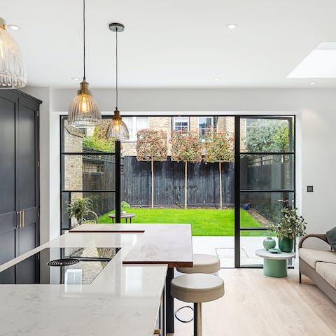 Savour your morning espresso at the modern breakfast bar, with the French doors open wide