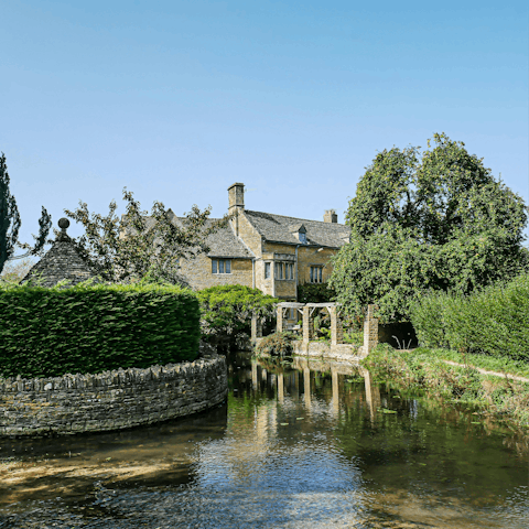 Explore scenic towns like Bourton-on-the-Water, a ten minute drive away