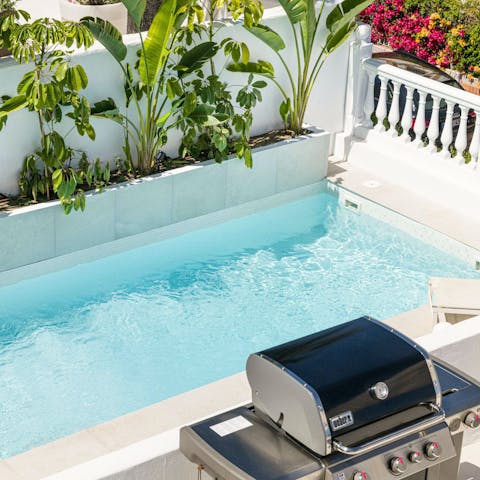 Fire up the grill for a barbecue poolside