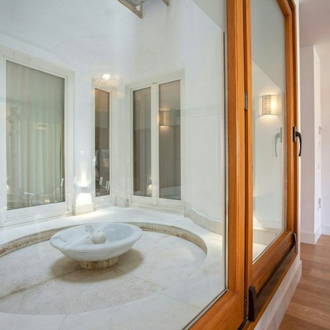 Listen to the soothing sounds of the fountain on the interior patio