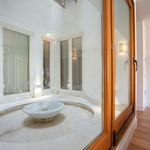 Listen to the soothing sounds of the fountain on the interior patio
