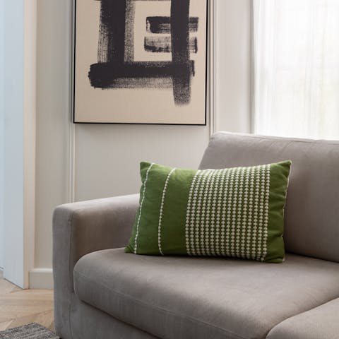 Kick back in the stylish living room with a glass of French wine after a day of exploring