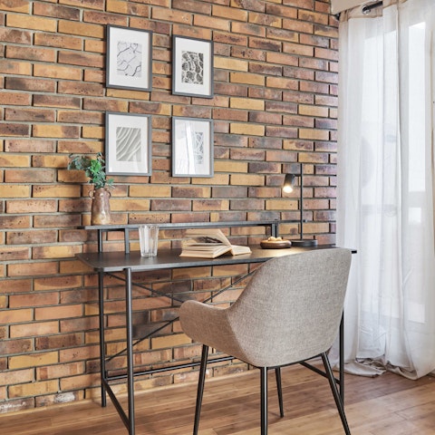 Turn the living area into your office, thanks to a desk