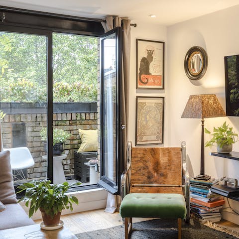 Kick back in the living room with a glass of wine and one of the many books on the shelves