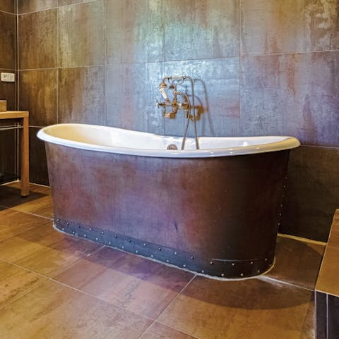 The deep antique brass bathtub