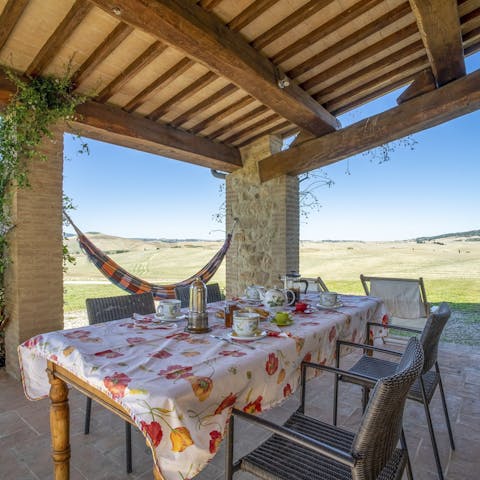 Gaze out at the Tuscan countryside as you dine alfresco