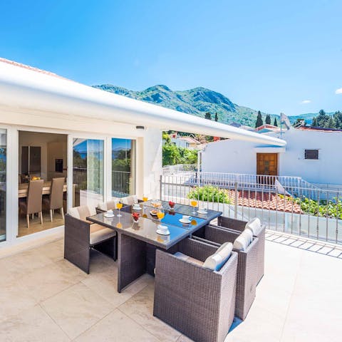 Dine out on the terrace and admire the hill and sea views