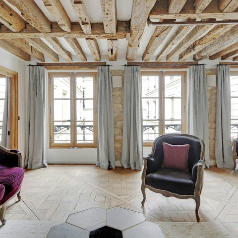 Relax in the characterful living room with a glass of French wine