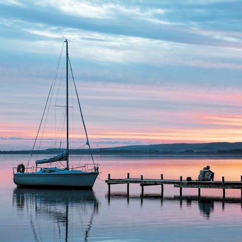 Watch the sun set on the shores of beautiful Lake Müritz
