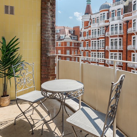 Sip drinks on the private balcony