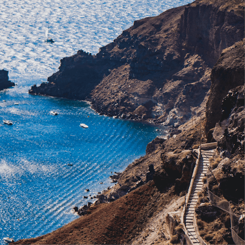 Hike across the mountainous terrain of Santorini
