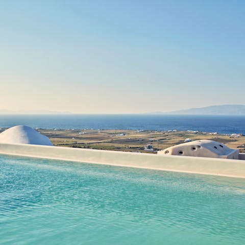 Enjoy a swim with sweeping views of the caldera