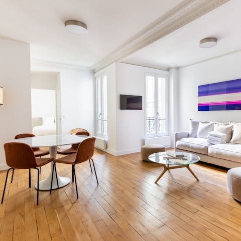 Relax in the bright living space with a glass of French wine