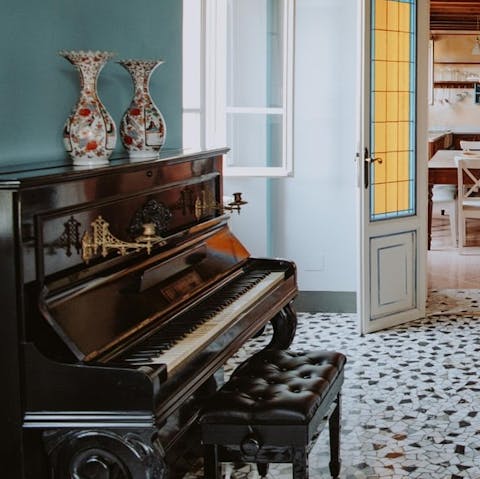 Entertain guests with an étude on the piano