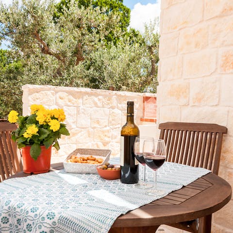 Relax with a glass of wine as the sun goes down